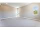 Spacious carpeted bedroom with multiple windows offering ample natural light at 128 Los Cabos Dr # 302, Las Vegas, NV 89144