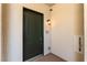 Elegant entrance door of condo with stylish outdoor lantern, and suite number, creating a welcoming entry at 128 Los Cabos Dr # 302, Las Vegas, NV 89144