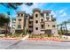 Stunning condo building with manicured landscaping, offering a luxurious and inviting curb appeal at 128 Los Cabos Dr # 302, Las Vegas, NV 89144