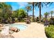Community hot tub surrounded by lush landscaping and resort buildings at 128 Los Cabos Dr # 302, Las Vegas, NV 89144