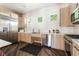 Modern kitchen with stainless steel appliances and dark wood floors at 128 Los Cabos Dr # 302, Las Vegas, NV 89144