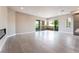 Bright living room featuring tile floors, fireplace, and access to a large outdoor balcony at 128 Los Cabos Dr # 302, Las Vegas, NV 89144