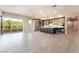 Inviting living room with open layout to kitchen, with a large sliding doors to balcony and modern finishes at 128 Los Cabos Dr # 302, Las Vegas, NV 89144