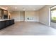 Stylish living room with kitchen and fireplace, with open concept and access to balcony at 128 Los Cabos Dr # 302, Las Vegas, NV 89144