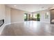 Bright living room featuring tile floors, fireplace, and access to a large outdoor balcony at 128 Los Cabos Dr # 302, Las Vegas, NV 89144
