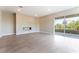 Elegant living room with balcony access and modern fireplace, providing natural light and seamless indoor/outdoor flow at 128 Los Cabos Dr # 302, Las Vegas, NV 89144
