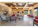 Relaxing patio with a fireplace, comfortable seating, and pool views at 128 Los Cabos Dr # 302, Las Vegas, NV 89144