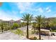 Scenic street view of the resort with palm trees and blue skies at 128 Los Cabos Dr # 302, Las Vegas, NV 89144