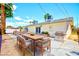 Backyard patio featuring an outdoor dining set and grill at 1700 Ivanhoe Way, Las Vegas, NV 89102