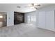Spacious bedroom featuring a decorative brick wall, large windows, and a ceiling fan at 1700 Ivanhoe Way, Las Vegas, NV 89102