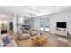 Bright living room featuring stylish furniture, modern lighting, and a view into the adjacent kitchen at 1700 Ivanhoe Way, Las Vegas, NV 89102
