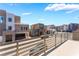 Community view from balcony shows nearby modern home exteriors and sunny skies at 1801 Flycatch St, Las Vegas, NV 89138
