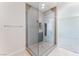Modern bathroom featuring a glass shower with gray tiling and neutral colored walls at 1801 Flycatch St, Las Vegas, NV 89138