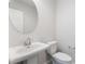 Powder room featuring a modern sink, mirror, and toilet at 1801 Flycatch St, Las Vegas, NV 89138