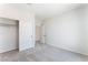 Bedroom with plush carpet, neutral walls, closet with sliding doors, and adjacent doorway at 1801 Flycatch St, Las Vegas, NV 89138