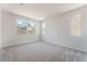 Bedroom features ample natural light from multiple windows and plush carpet at 1801 Flycatch St, Las Vegas, NV 89138