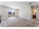 Bright bedroom featuring a sliding glass door with balcony access and ensuite bath at 1801 Flycatch St, Las Vegas, NV 89138