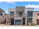Modern two-story home features a balcony, two-car garage and contemporary architectural design at 1801 Flycatch St, Las Vegas, NV 89138