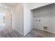 Hallway with carpeted floor, neutral walls, open closet, and doorways at 1801 Flycatch St, Las Vegas, NV 89138