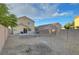 An overview of the back yard featuring rock landscaping, a patio, and block wall at 189 Paxon Hollow Ct, Las Vegas, NV 89148