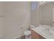 Powder room features modern fixtures, including a sleek vanity and toilet at 189 Paxon Hollow Ct, Las Vegas, NV 89148