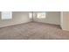 A large bedroom featuring carpet, windows, and lots of space at 189 Paxon Hollow Ct, Las Vegas, NV 89148