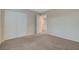 Carpeted bedroom with a closet and an open doorway leading to another room at 189 Paxon Hollow Ct, Las Vegas, NV 89148