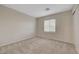 Neutral bedroom featuring carpet, a window with blinds, and a closet at 189 Paxon Hollow Ct, Las Vegas, NV 89148