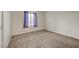 Bedroom with neutral carpet, curtains on the window, and light-colored walls at 189 Paxon Hollow Ct, Las Vegas, NV 89148