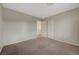 Empty bedroom featuring neutral carpet, light walls, and closet at 189 Paxon Hollow Ct, Las Vegas, NV 89148