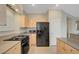 Efficient kitchen features light cabinets, stainless steel appliances, and granite counter tops at 189 Paxon Hollow Ct, Las Vegas, NV 89148
