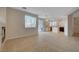 Bright living room boasts neutral walls, recessed lights, and large windows with backyard access at 189 Paxon Hollow Ct, Las Vegas, NV 89148