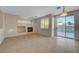 Living room featuring tile flooring, a fireplace, and sliding glass doors to the outdoor area at 189 Paxon Hollow Ct, Las Vegas, NV 89148