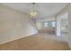 Large living room with tile flooring and staircase to the second floor at 189 Paxon Hollow Ct, Las Vegas, NV 89148