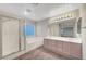 This main bathroom features dual sinks, a vanity, standing shower, and a bath tub at 189 Paxon Hollow Ct, Las Vegas, NV 89148