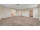 The main bedroom featuring carpet, view of bathroom and walk-in closet at 189 Paxon Hollow Ct, Las Vegas, NV 89148