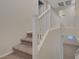 Carpeted staircase with white railing leading to the upper level of the home at 189 Paxon Hollow Ct, Las Vegas, NV 89148
