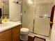 Clean bathroom features a glass shower, vanity with storage, and updated fixtures at 213 Luninborg St, Henderson, NV 89074
