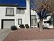 Charming two-story home featuring a well-maintained lawn and attached garage at 213 Luninborg St, Henderson, NV 89074