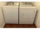 A laundry room features a white washing machine and dryer set against a clean, modern interior at 213 Luninborg St, Henderson, NV 89074