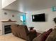 Cozy living room features a fireplace, hardwood floors, and ample natural light at 213 Luninborg St, Henderson, NV 89074