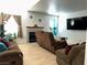Inviting living room offers a cozy fireplace, neutral paint, and plenty of sunlight at 213 Luninborg St, Henderson, NV 89074
