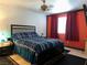 Spacious bedroom featuring a large window, neutral walls, and modern furnishings at 213 Luninborg St, Henderson, NV 89074