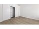 Bedroom with large closet space and elegant wood-look flooring at 2251 Wigwam Pkwy # 424, Henderson, NV 89074