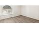 Bright bedroom featuring a large window seat and elegant wood-look flooring at 2251 Wigwam Pkwy # 424, Henderson, NV 89074