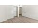 Bedroom with sliding closet doors and wood-look flooring at 2251 Wigwam Pkwy # 424, Henderson, NV 89074