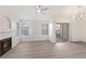 Bright living room showcasing a cozy fireplace, ceiling fan, and sliding glass door to a balcony at 2251 Wigwam Pkwy # 424, Henderson, NV 89074