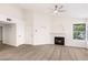 Living room featuring vaulted ceiling, fireplace, and windows providing lots of natural light at 2251 Wigwam Pkwy # 424, Henderson, NV 89074