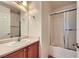 Bathroom featuring a vanity with a sink and a shower-tub with glass doors at 2509 April Breeze Ln, Henderson, NV 89002