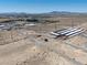 Wide aerial view showing storage units, community, and distant mountain range at 2530 Commercial Dr, Pahrump, NV 89048